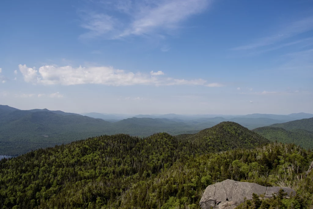 I'm unfamiliar with the nearby mountains and lakes, at least one of them is probably Saranac.