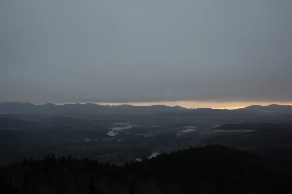 The second the sun came up above the mountains it disappeared behind the clouds.