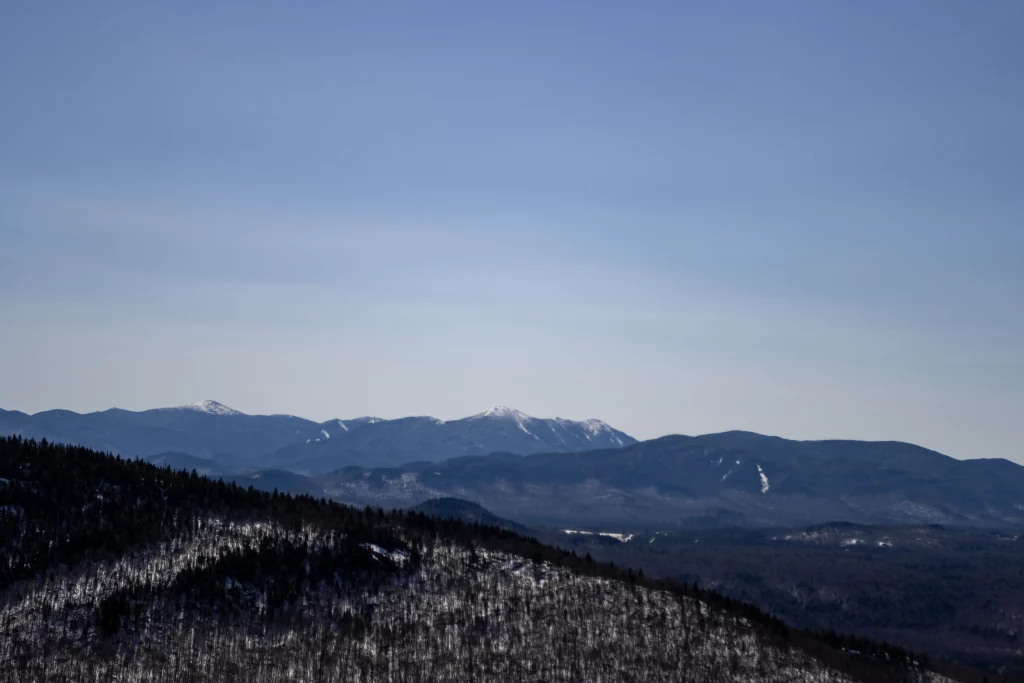 High Peaks are pictured off the in distance, this may be Marcy and some others, not sure though.