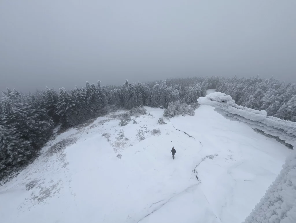 It looks as though there may be large concrete pads underneath the ice up here on the top of the mountain.